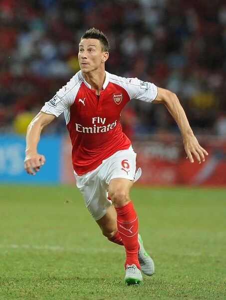 Arsenal's Laurent Koscielny in Action Against Everton at 2015 Asia Trophy, Singapore