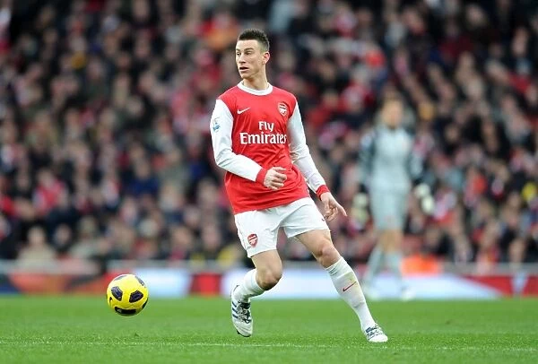 Arsenal's Laurent Koscielny Celebrates after 3-0 Win over Wigan Athletic in the Barclays Premier League
