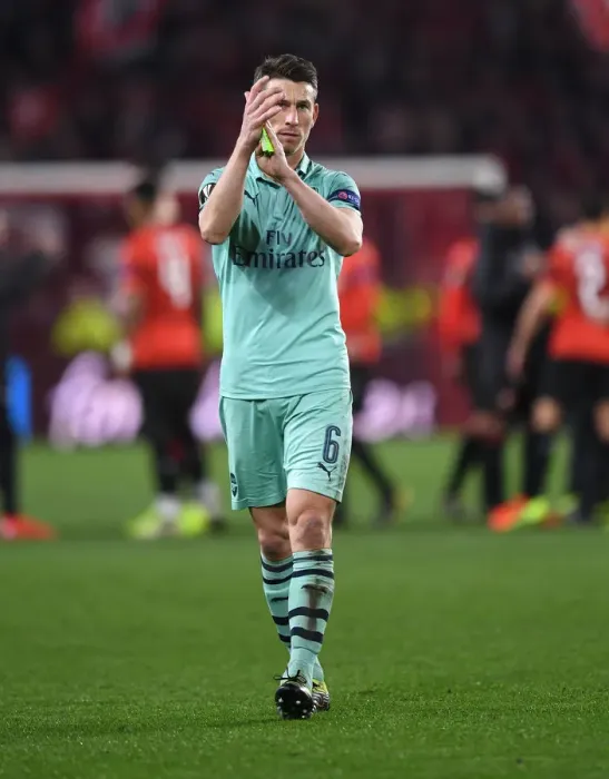 Framed Print : Arsenal's Laurent Koscielny Celebrates with Fans after First Leg of Europa League Match against Stade Rennais Framed Print : Arsenal's Laurent Koscielny Celebrates with Fans after First Leg of Europa League Match against Stade Rennais