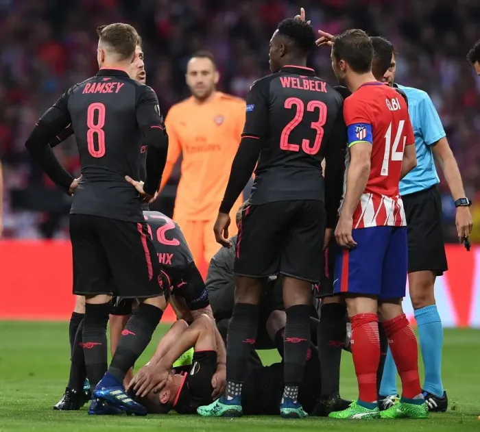 Framed Print : Arsenal's Laurent Koscielny Injured in UEFA Europa League Semi-Final Clash Against Atletico Madrid