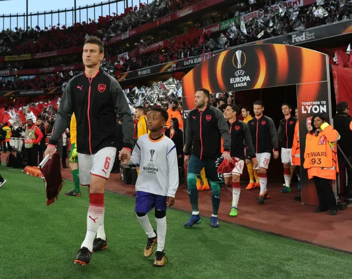 Framed Print : Arsenal's Laurent Koscielny Leads Out Team Against Atletico Madrid in Europa League Semi-Final Framed Print : Arsenal's Laurent Koscielny Leads Out Team Against Atletico Madrid in Europa League Semi-Final