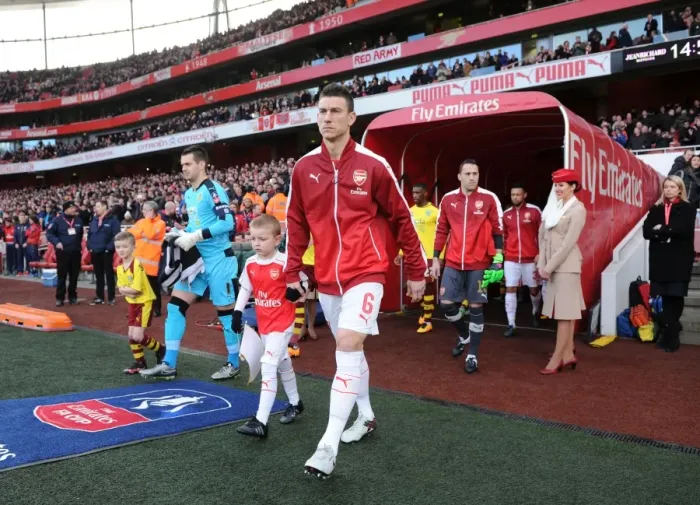 Framed Print : Arsenal's Laurent Koscielny Leads Team Out Against Burnley in FA Cup Fourth Round