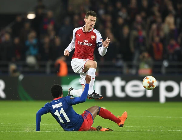 Arsenal's Laurent Koscielny Outmaneuvers Vitinho in UEFA Europa League Quarterfinal Clash