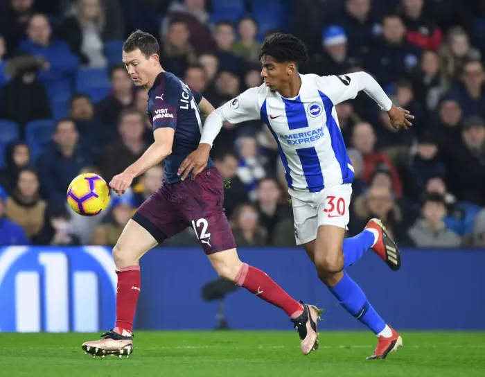 Framed Print : Arsenal's Lichtsteiner Battles Past Brighton's Bernardo in Premier League Clash