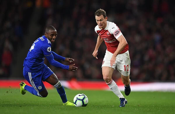 Arsenal's Lichtsteiner Clashes with Leicester's Pereira in Premier League Showdown