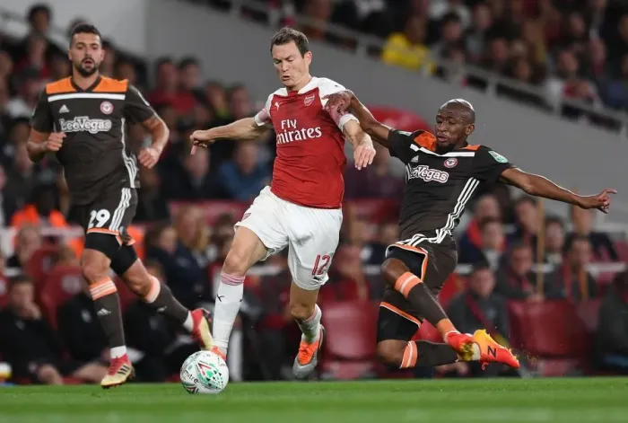 Framed Print : Arsenal's Lichtsteiner Clashes with Mokotjo in Carabao Cup Showdown Framed Print : Arsenal's Lichtsteiner Clashes with Mokotjo in Carabao Cup Showdown