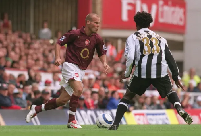 Framed Print : Arsenal's Ljungberg and Babayaro Clash in FA Premier League Showdown: Arsenal 2-0 Newcastle United at Highbury, 2005