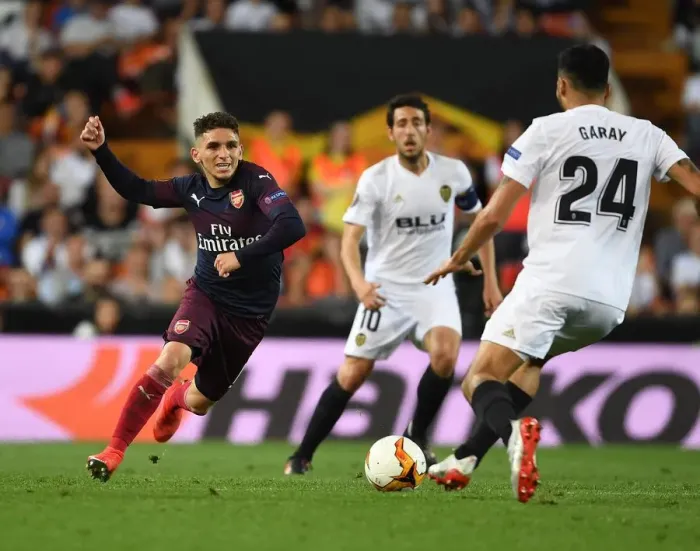 Framed Print : Arsenal's Lucas Torreira Clashes with Valencia's Ezequiel Garay in UEFA Europa League Semi-Final