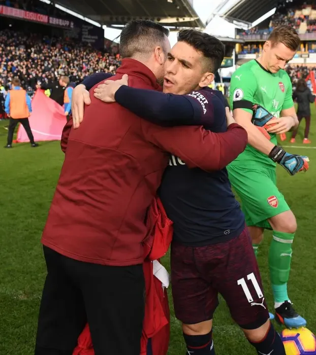Framed Print : Arsenal's Lucas Torreira Embraces Kit Manager Before Huddersfield Match