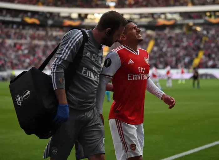 Framed Print : Arsenal's Lucas Torreira Receives Treatment from Physio during Eintracht Frankfurt Clash (UEFA Europa League 2019-20) Framed Print : Arsenal's Lucas Torreira Receives Treatment from Physio during Eintracht Frankfurt Clash (UEFA Europa League 2019-20)