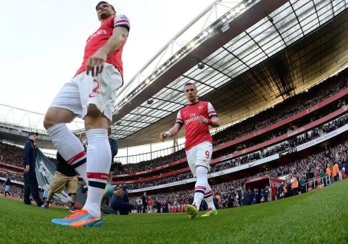 Framed Print : Arsenal's Lukas Podolski Gears Up for Arsenal vs Manchester City (2013 / 14)