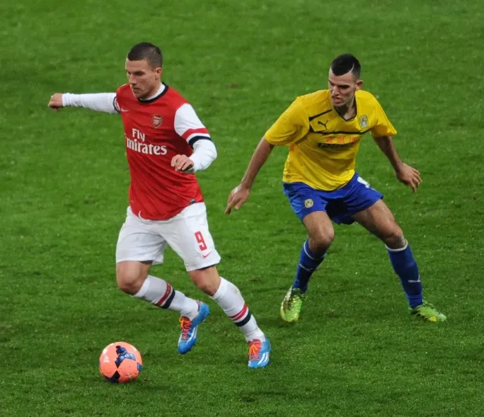 Framed Print : Arsenal's Lukas Podolski Outruns Coventry's Conor Thomas in FA Cup Fourth Round Clash Framed Print : Arsenal's Lukas Podolski Outruns Coventry's Conor Thomas in FA Cup Fourth Round Clash