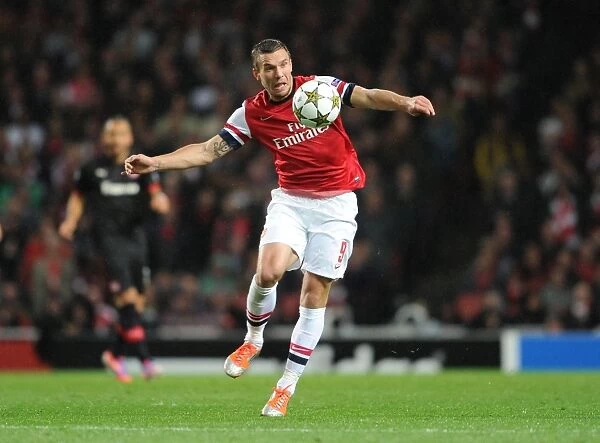 Arsenal's Lukas Podolski Scores in 3-1 Victory over Olympiacos in UEFA Champions League Group Stage at Emirates Stadium