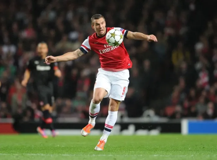 Framed Print : Arsenal's Lukas Podolski Scores in 3-1 Victory over Olympiacos in UEFA Champions League Group Stage at Emirates Stadium