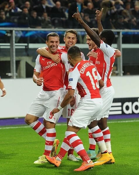 Arsenal's Lukas Podolski Scores and Celebrates with Teammates against RSC Anderlecht in UEFA Champions League, 2014
