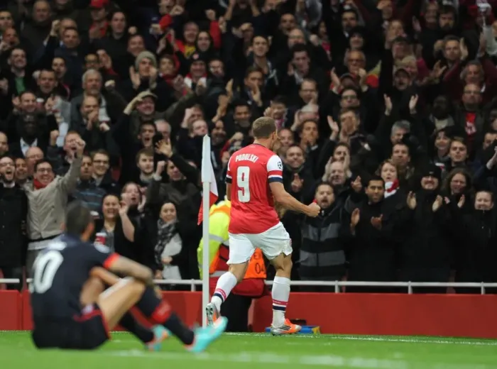 Framed Print : Arsenal's Lukas Podolski Scores Second Goal Against Olympiacos in UEFA Champions League: Arsenal 3-1 Framed Print : Arsenal's Lukas Podolski Scores Second Goal Against Olympiacos in UEFA Champions League: Arsenal 3-1