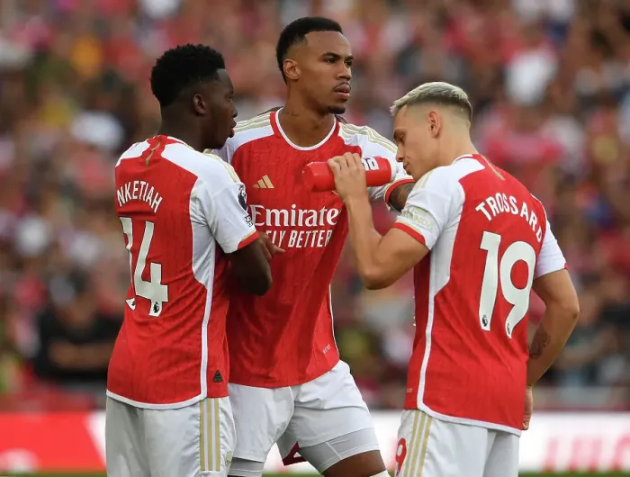 Framed Print : Arsenal's Magalhaes, Ketaih, and Trossard in Action against Manchester City (2023-24)