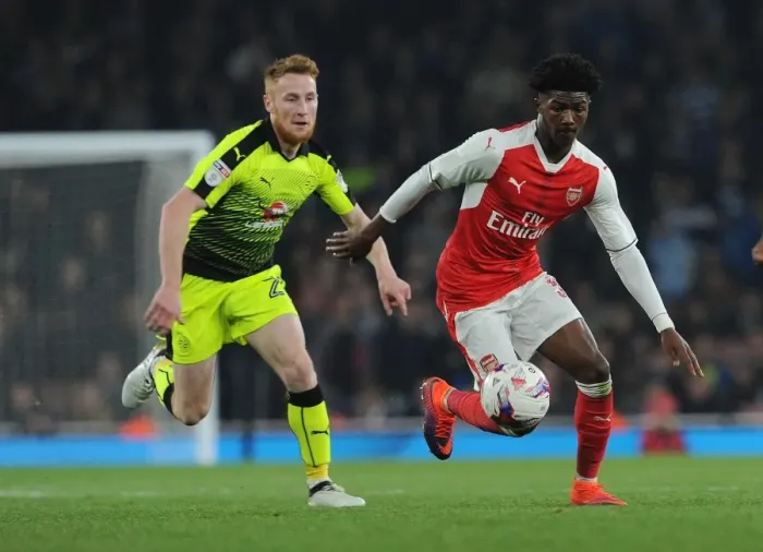 Framed Print : Arsenal's Maitland-Niles Clashes with Reading's Quinn in EFL Cup Showdown