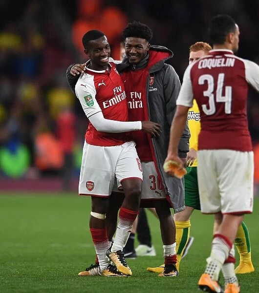 Arsenal's Maitland-Niles and Nketiah Embrace in Carabao Cup Victory Celebration