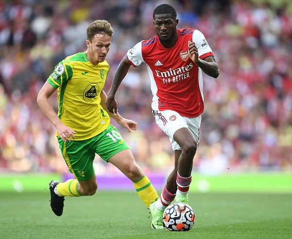 Arsenal's Maitland-Niles Outmaneuvers Norwich's Dowell in Premier League Clash