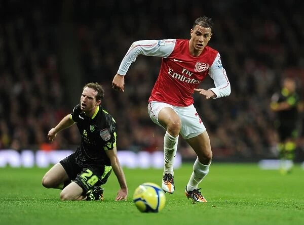 Arsenal's Marouane Chamakh Breaks Past Leeds Aidan White in FA Cup Clash