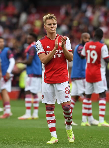Arsenal's Martin Odegaard Celebrates with Fans after Arsenal v Norwich City Win