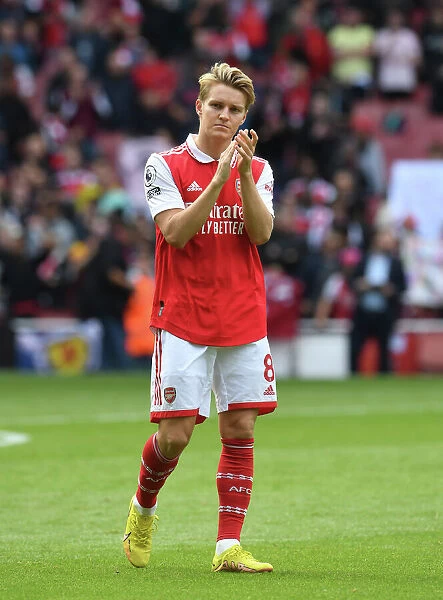 Arsenal's Martin Odegaard Celebrates with Fans after Arsenal vs. Tottenham Match, 2022-23 Premier League
