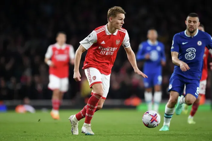 Framed Print : Arsenal's Martin Odegaard Charges Forward Against Chelsea in Premier League Showdown (2022-23) Framed Print : Arsenal's Martin Odegaard Charges Forward Against Chelsea in Premier League Showdown (2022-23)