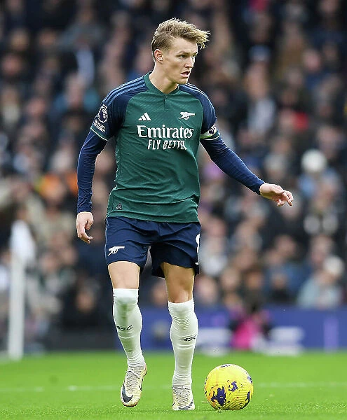 Arsenal's Martin Odegaard Charges Forward in Premier League Clash Against Fulham (2023-24)