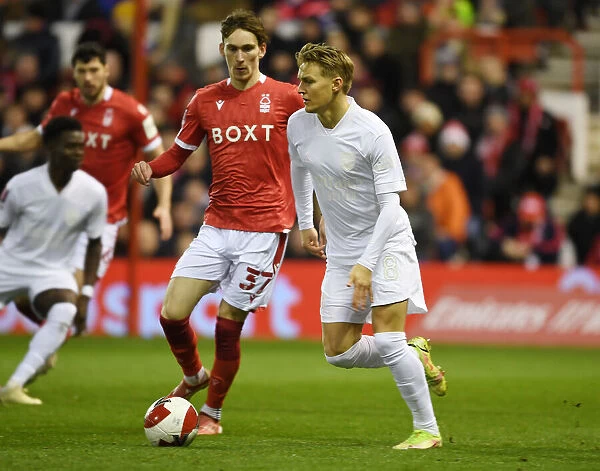 Arsenal's Martin Odegaard Clashes with Nottingham Forest's James Garner in FA Cup Third Round