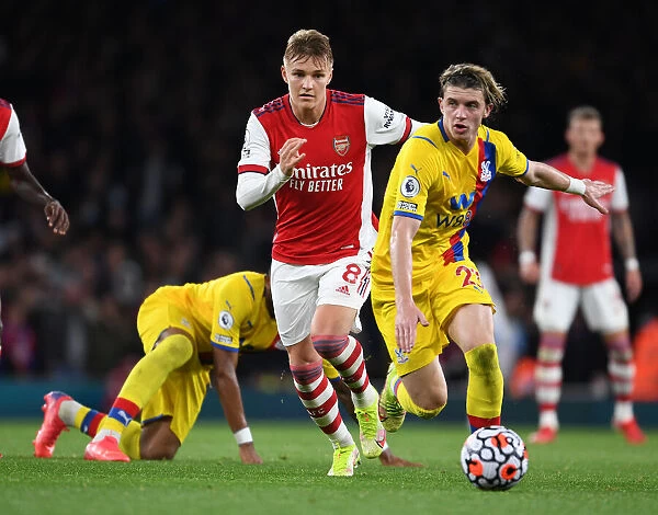 Arsenal's Martin Odegaard Dashes Past Crystal Palace's Connor Gallagher in Premier League Clash