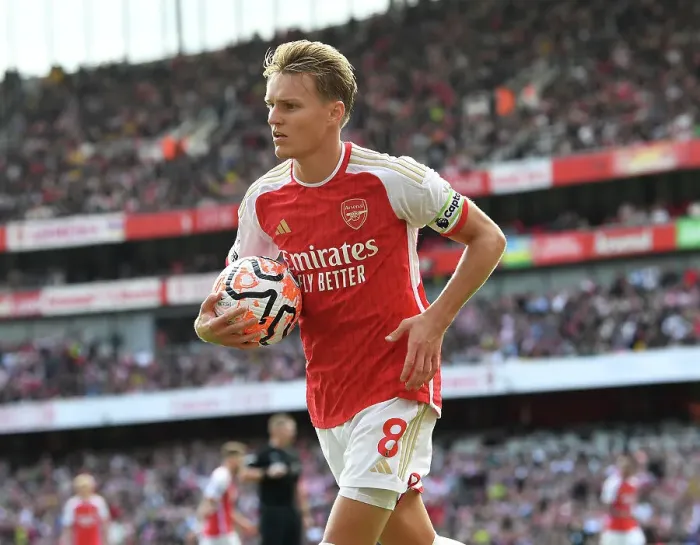 Framed Print : Arsenal's Martin Odegaard Faces Off Against Tottenham in the 2023-24 Premier League Clash at Emirates Stadium