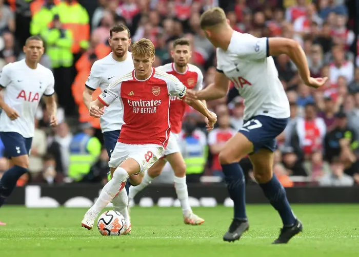 Framed Print : Arsenal's Martin Odegaard Faces Off Against Tottenham in the 2023-24 Premier League Showdown at Emirates Stadium Framed Print : Arsenal's Martin Odegaard Faces Off Against Tottenham in the 2023-24 Premier League Showdown at Emirates Stadium