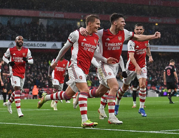 Arsenal's Martin Odegaard and Kieran Tierney Celebrate Goal Against Southampton (December 2021)