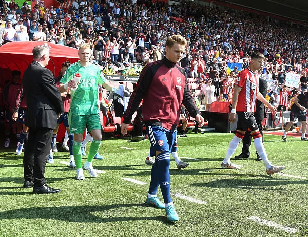 Arsenal's Martin Odegaard Leads Team Out vs Southampton in Premier League Showdown (2021-22)