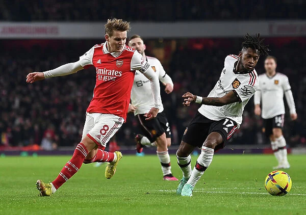 Arsenal's Martin Odegaard Outmaneuvers Manchester United's Fred in Premier League Clash