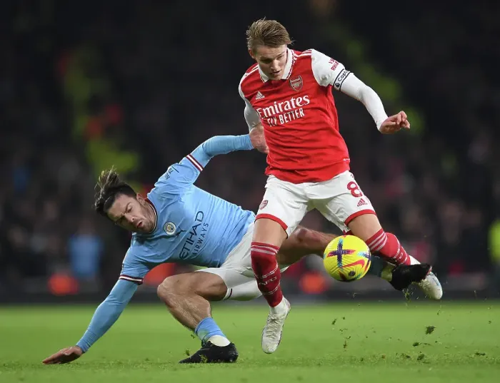 Framed Print : Arsenal's Martin Odegaard Outsmarts Jack Grealish: Intense Battle in Arsenal vs. Manchester City Framed Print : Arsenal's Martin Odegaard Outsmarts Jack Grealish: Intense Battle in Arsenal vs. Manchester City