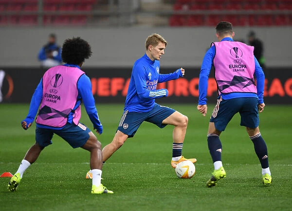 Arsenal's Martin Odegaard Prepares for Olympiacos Clash in Empty Europa League Stadium