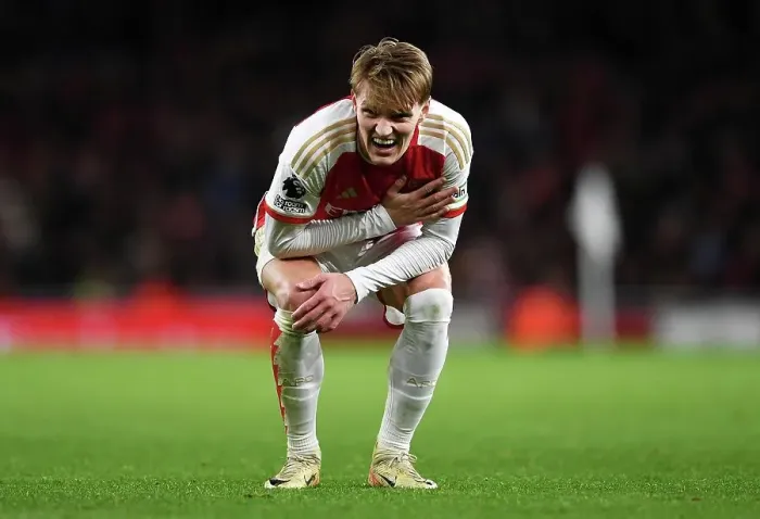 Framed Print : Arsenal's Martin Odegaard Reacts to Injury During Arsenal v West Ham United (2023-24)