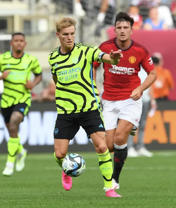 Framed Print : Arsenal's Martin Odegaard Shines: Outperforming Manchester United at MetLife Stadium (2023)