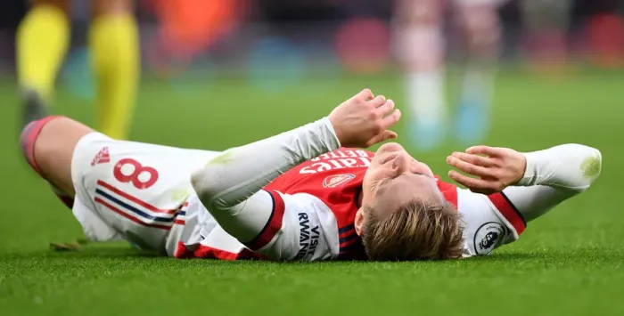 Framed Print : Arsenal's Martin Odegaard Suffers Injury in Arsenal vs. Brentford Clash at Emirates Stadium Framed Print : Arsenal's Martin Odegaard Suffers Injury in Arsenal vs. Brentford Clash at Emirates Stadium
