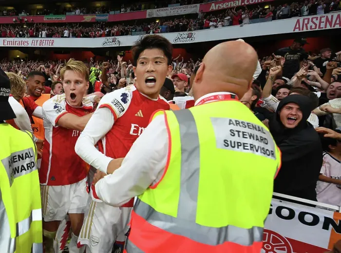 Framed Print : Arsenal's Martin Odegaard and Takehiro Tomiyasu Celebrate Gabriel Martinelli's Goal Against Manchester City (2023-24)