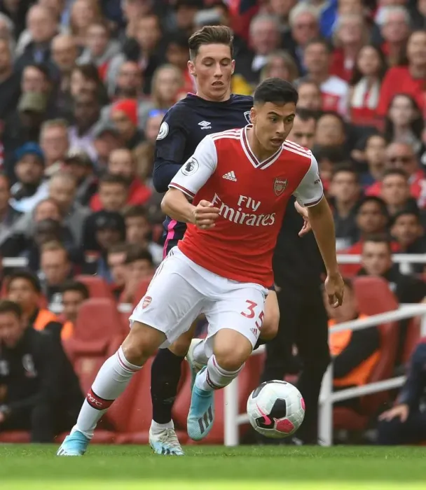 Framed Print : Arsenal's Martinelli Clashes with Bournemouth's Wilson in Premier League Showdown