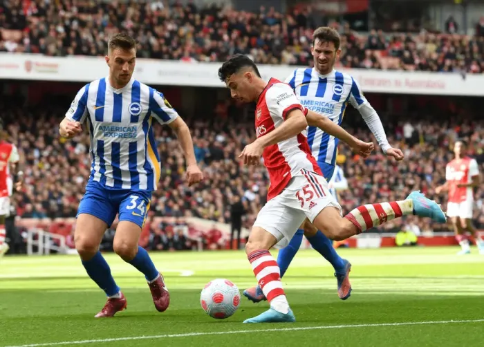 Framed Print : Arsenal's Martinelli Clashes with Brighton's Veltman and Gross: Intense Battle in the Premier League (April 2022)
