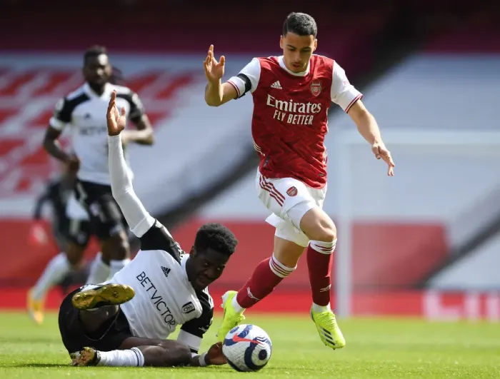 Framed Print : Arsenal's Martinelli Clashes with Fulham's Aina in Empty Emirates Stadium, April 2021 Framed Print : Arsenal's Martinelli Clashes with Fulham's Aina in Empty Emirates Stadium, April 2021