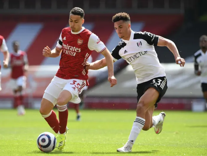 Framed Print : Arsenal's Martinelli Clashes with Fulham's Robinson in Empty Emirates Stadium, Premier League 2020-21