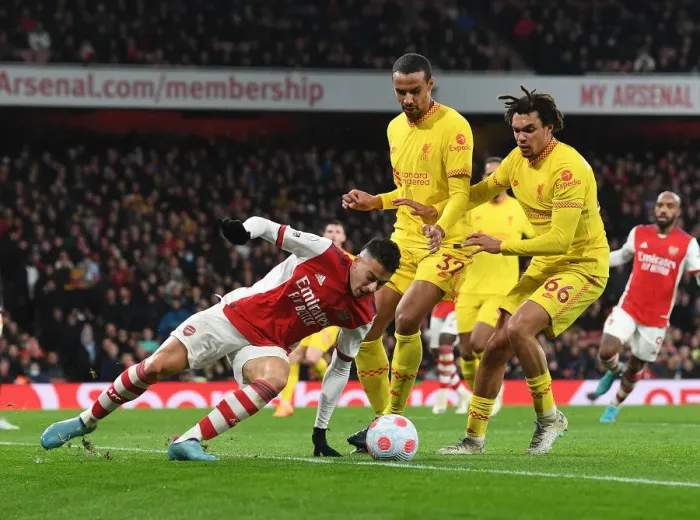 Framed Print : Arsenal's Martinelli Clashes with Liverpool's Alexander-Arnold and Matip in Premier League Showdown Framed Print : Arsenal's Martinelli Clashes with Liverpool's Alexander-Arnold and Matip in Premier League Showdown