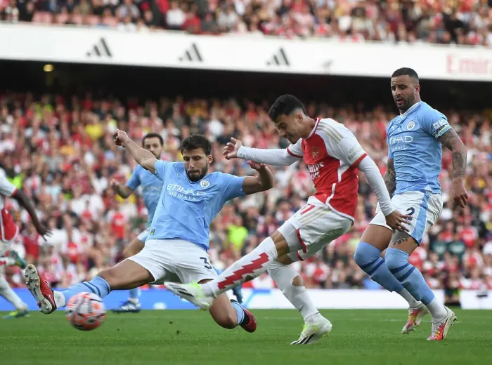 Framed Print : Arsenal's Martinelli Clashes with Manchester City's Dias and Walker in 2023-24 Premier League Showdown