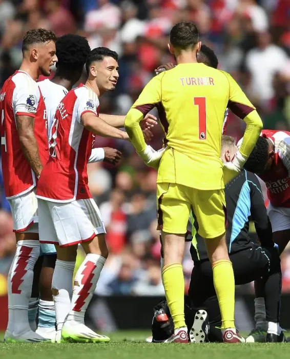 Framed Print : Arsenal's Martinelli Engages With Nottingham Forest's Turner During Premier League Clash (2023-24)