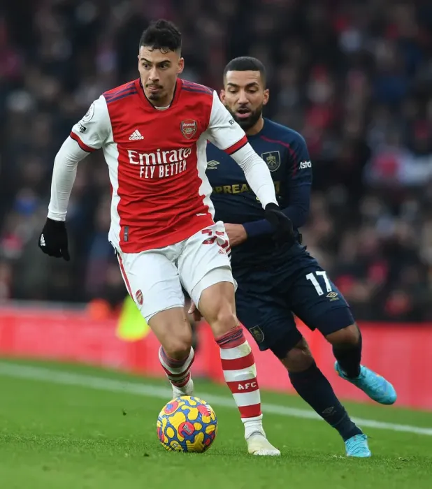 Framed Print : Arsenal's Martinelli Faces Off Against Burnley's Lennon in Premier League Clash Framed Print : Arsenal's Martinelli Faces Off Against Burnley's Lennon in Premier League Clash